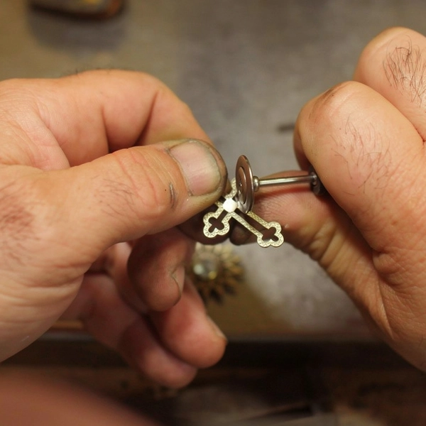 Gold Cross Pendant in Work