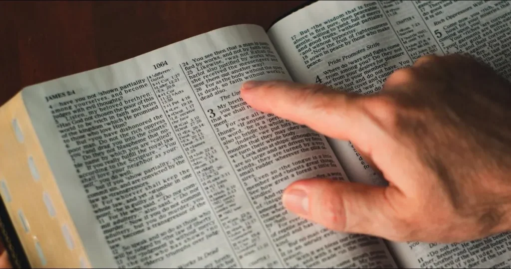 Open Bible showing James 2 and the passage about faith and works